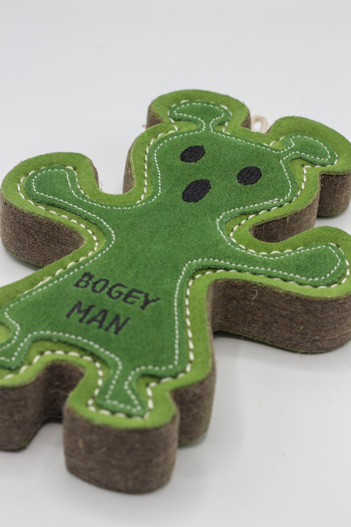 Green and brown dog toy shaped like a 'BOGEY MAN'