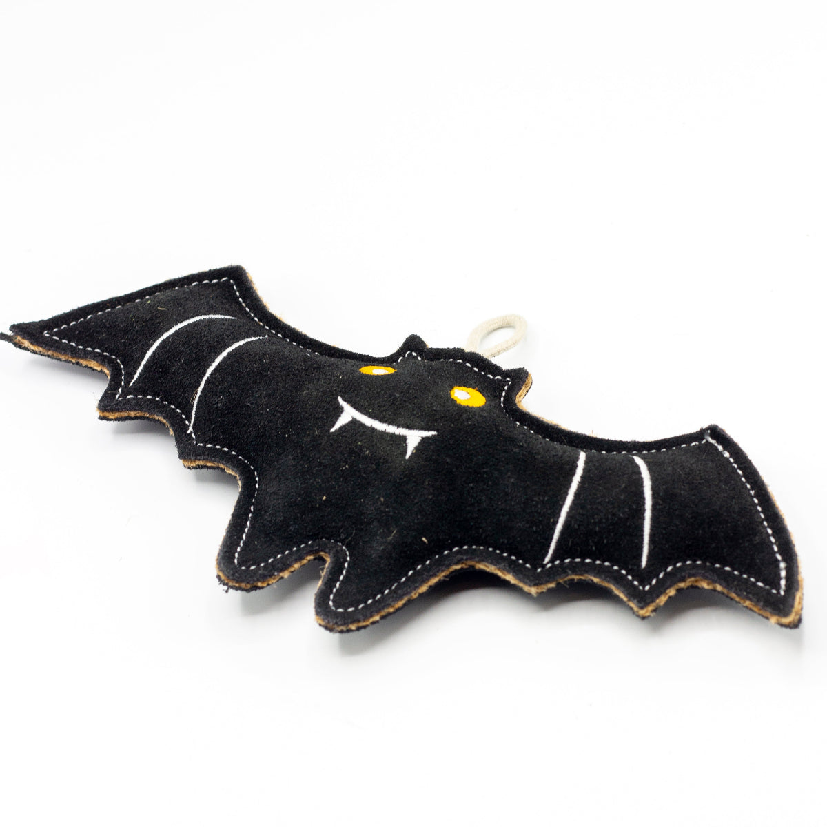 Black bat-shaped non-toxic dog toy with white accents