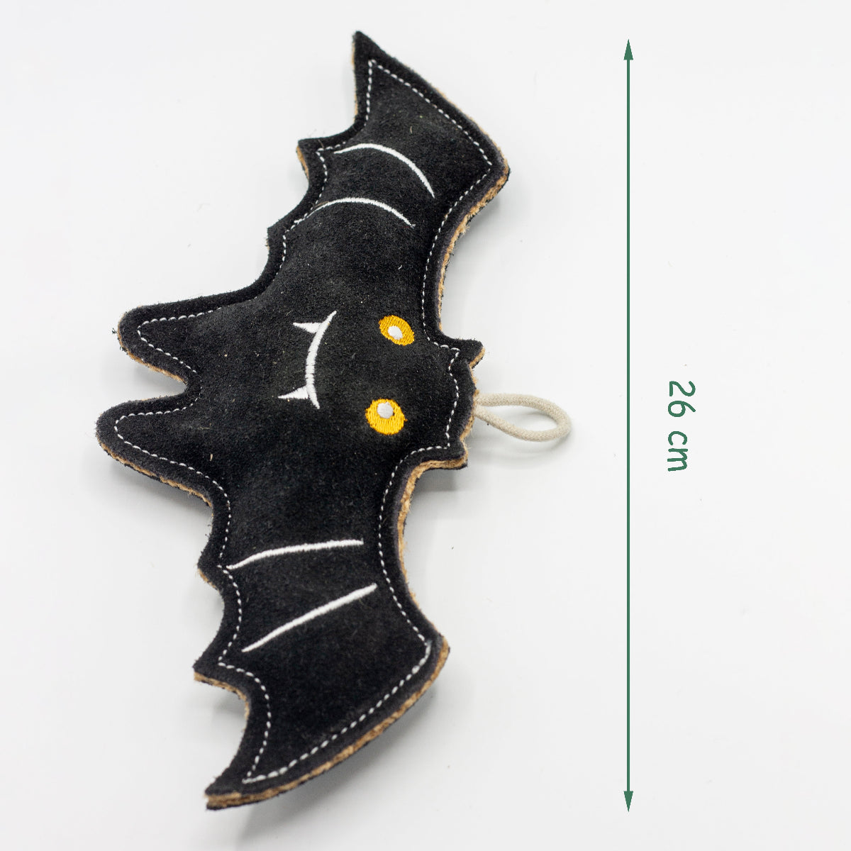 Black bat-shaped non-toxic dog toy with yellow eyes and white accents, with dimensions