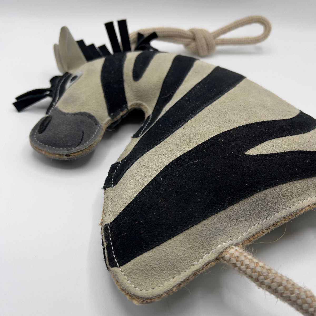 Zebra-shaped horse and dog toy with rope handle from green and wilds