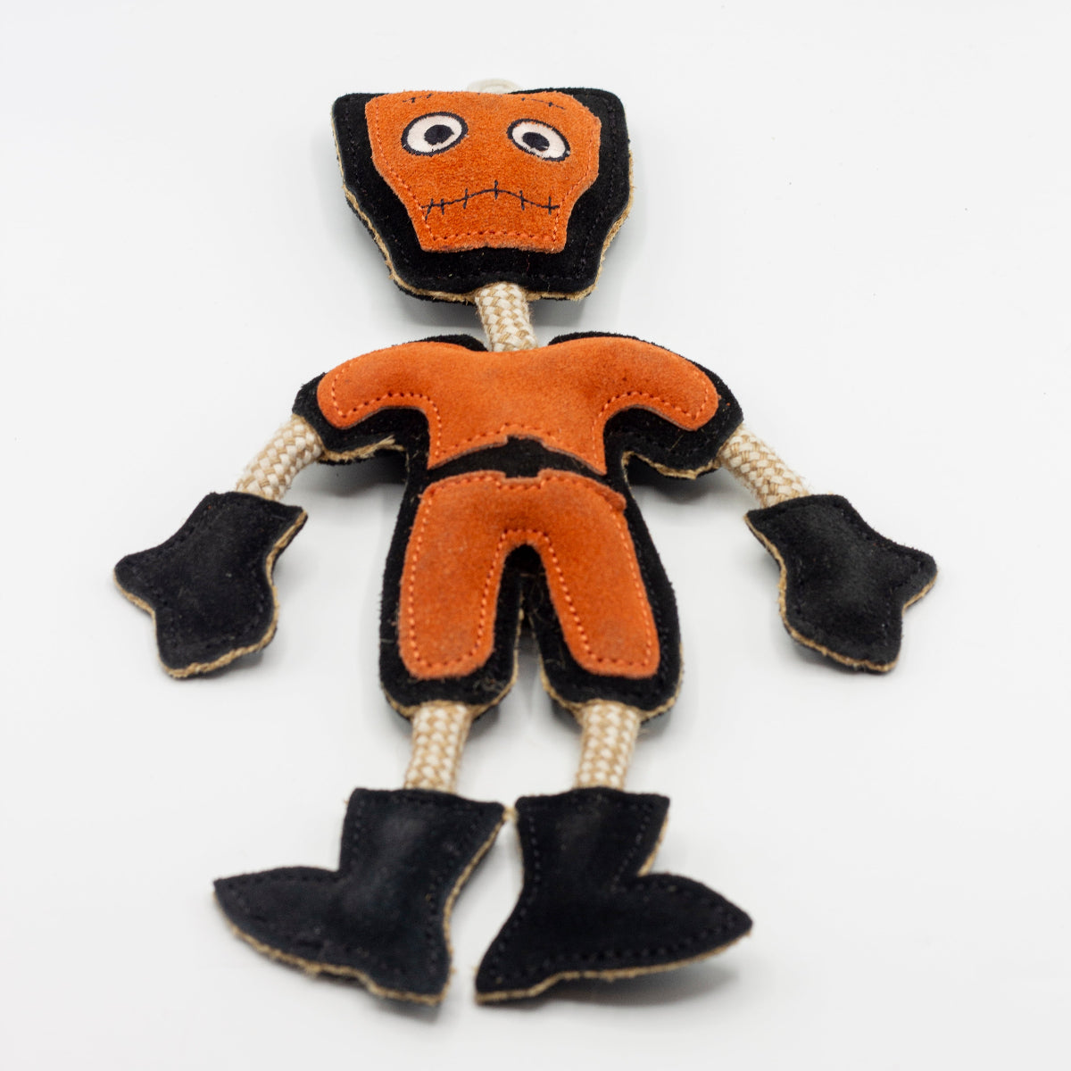 Halloween dog toy resembling an orange and black monster