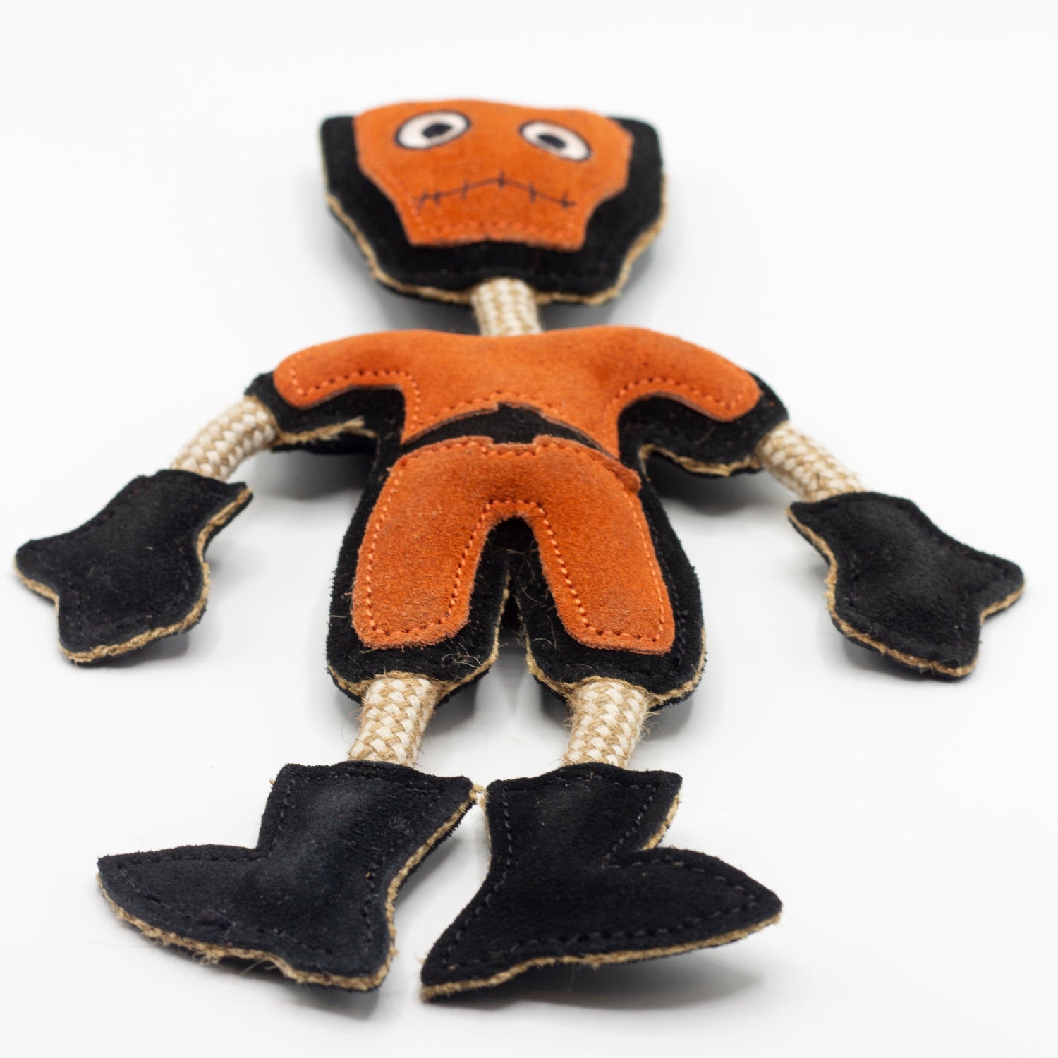 Halloween dog toy resembling an orange and black monster