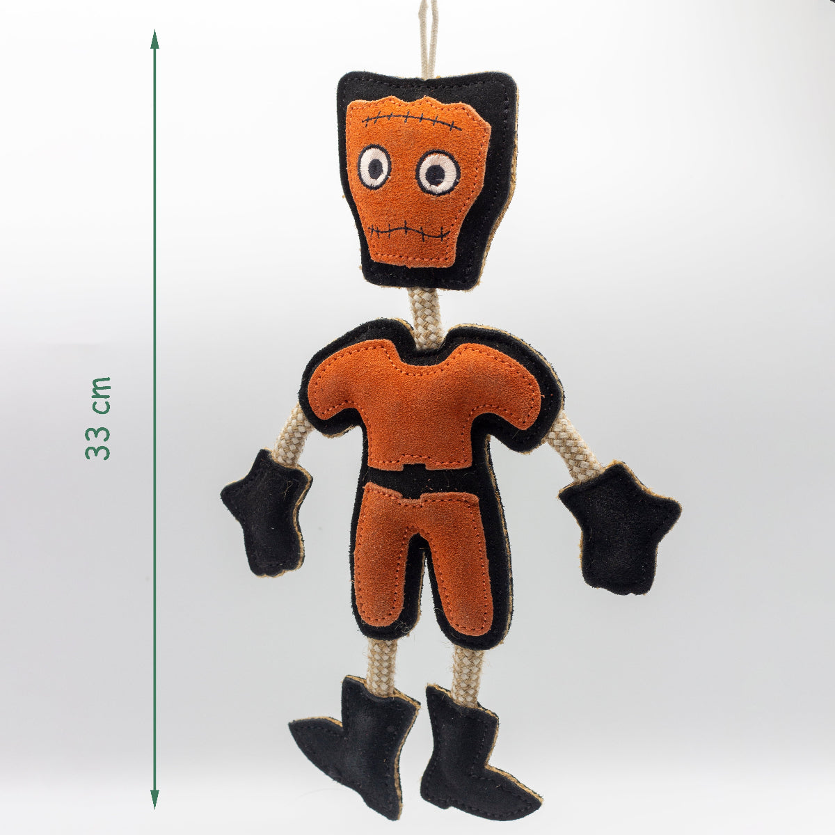 Halloween dog toy resembling an orange and black monster with dimensions