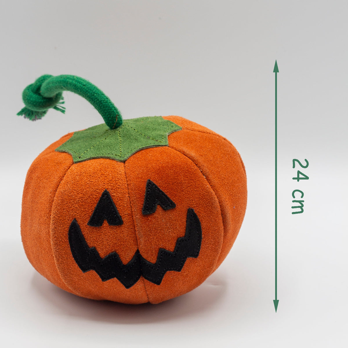 Pumpkin dog toy with a jack-o'-lantern face with dimensions