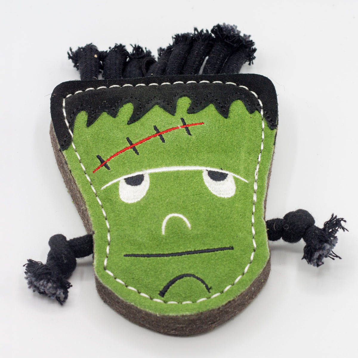 Halloween dog toy resembling a monster with black hair and stitch