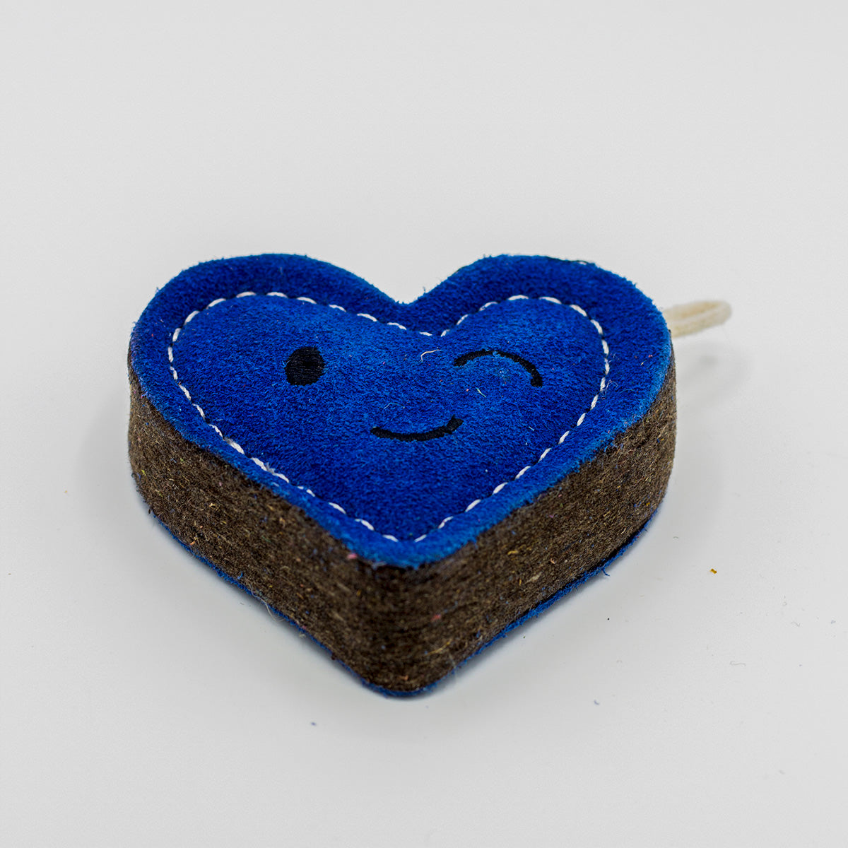 Heart-shaped blue eco friendly dog toy with a winky face