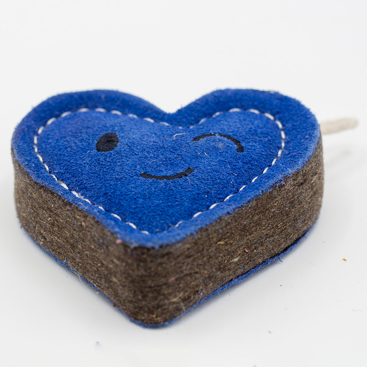 Heart-shaped blue eco friendly dog toy with a winky face