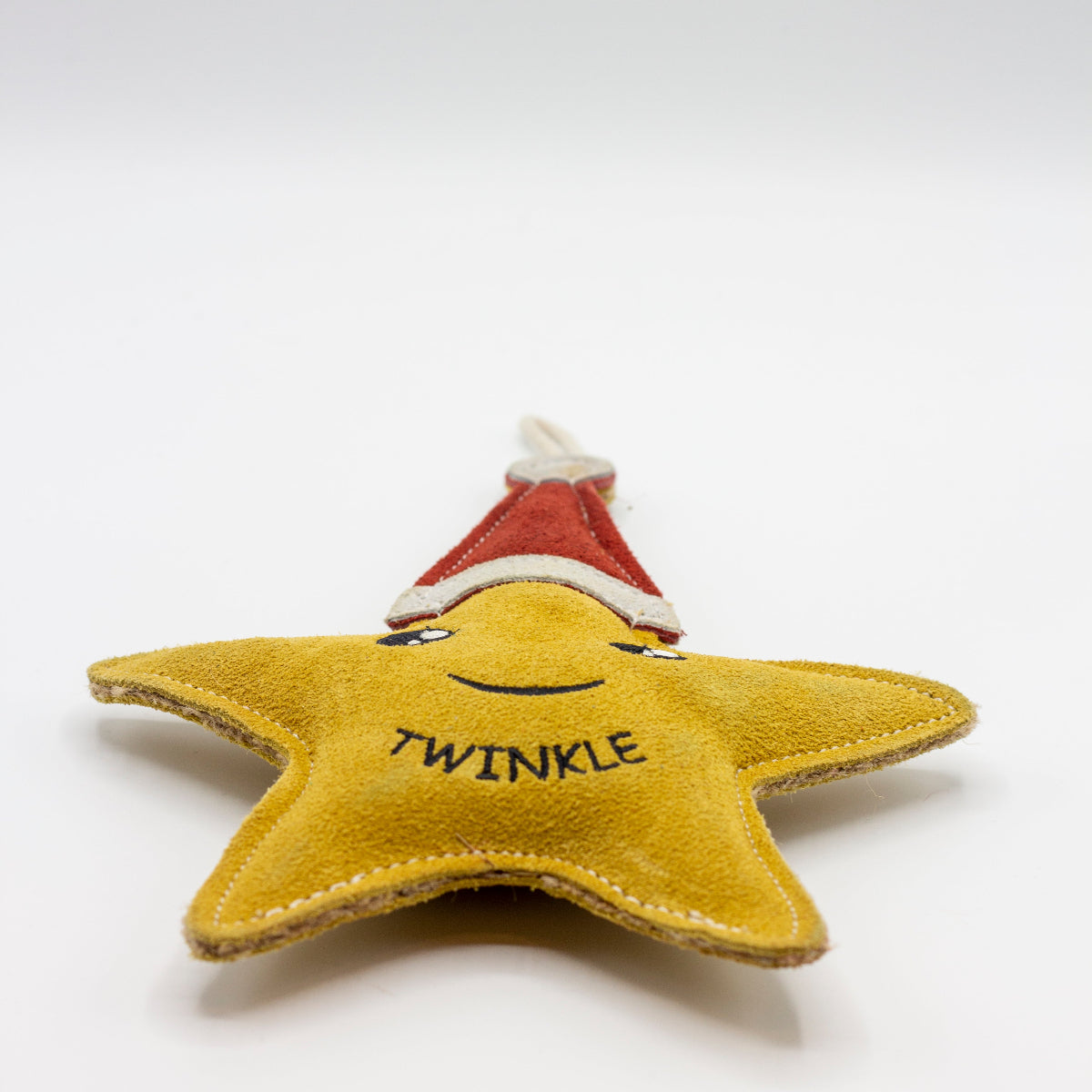 Star-shaped Christmas dog toy with a red Santa hat and 'Twinkle' text on a white background
