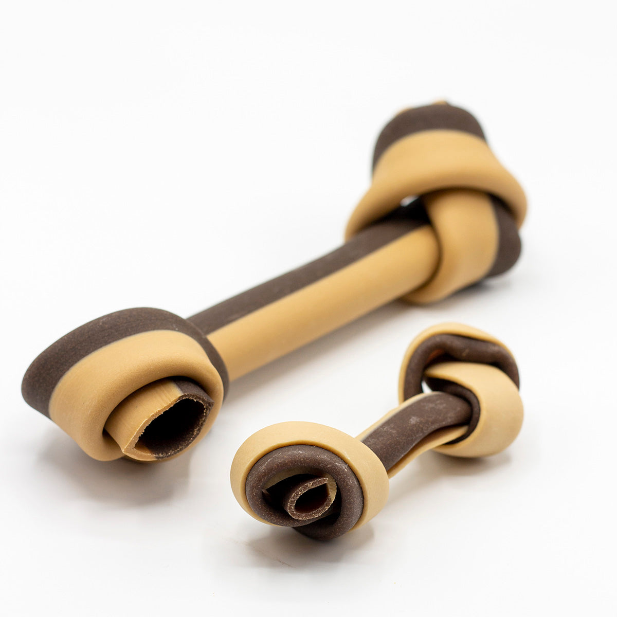 Two brown and beige Veggie dog chews