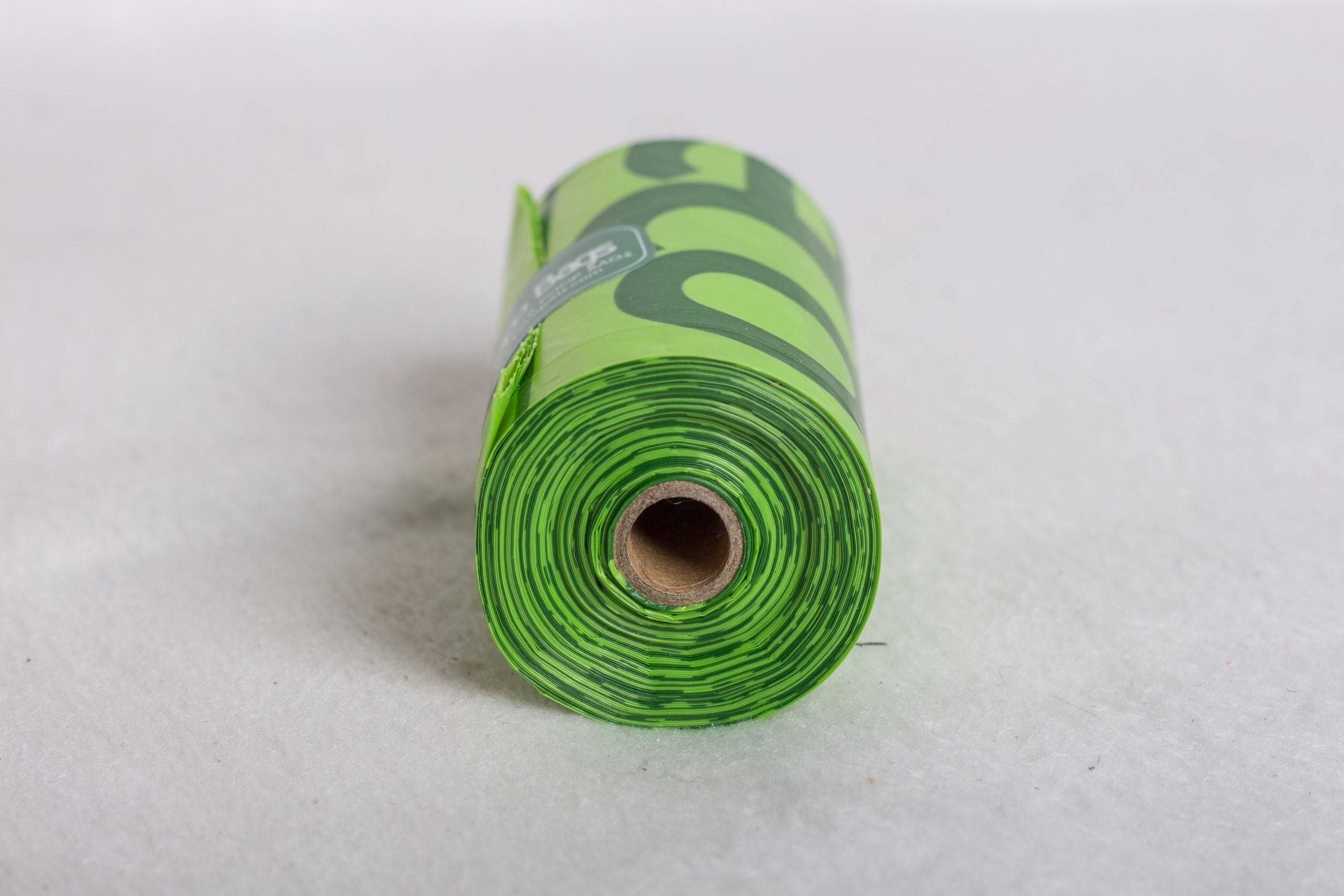 A roll of degradable poo bags with a cardboard core
