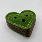 Heart-shaped green eco friendly dog toy with a surprised face