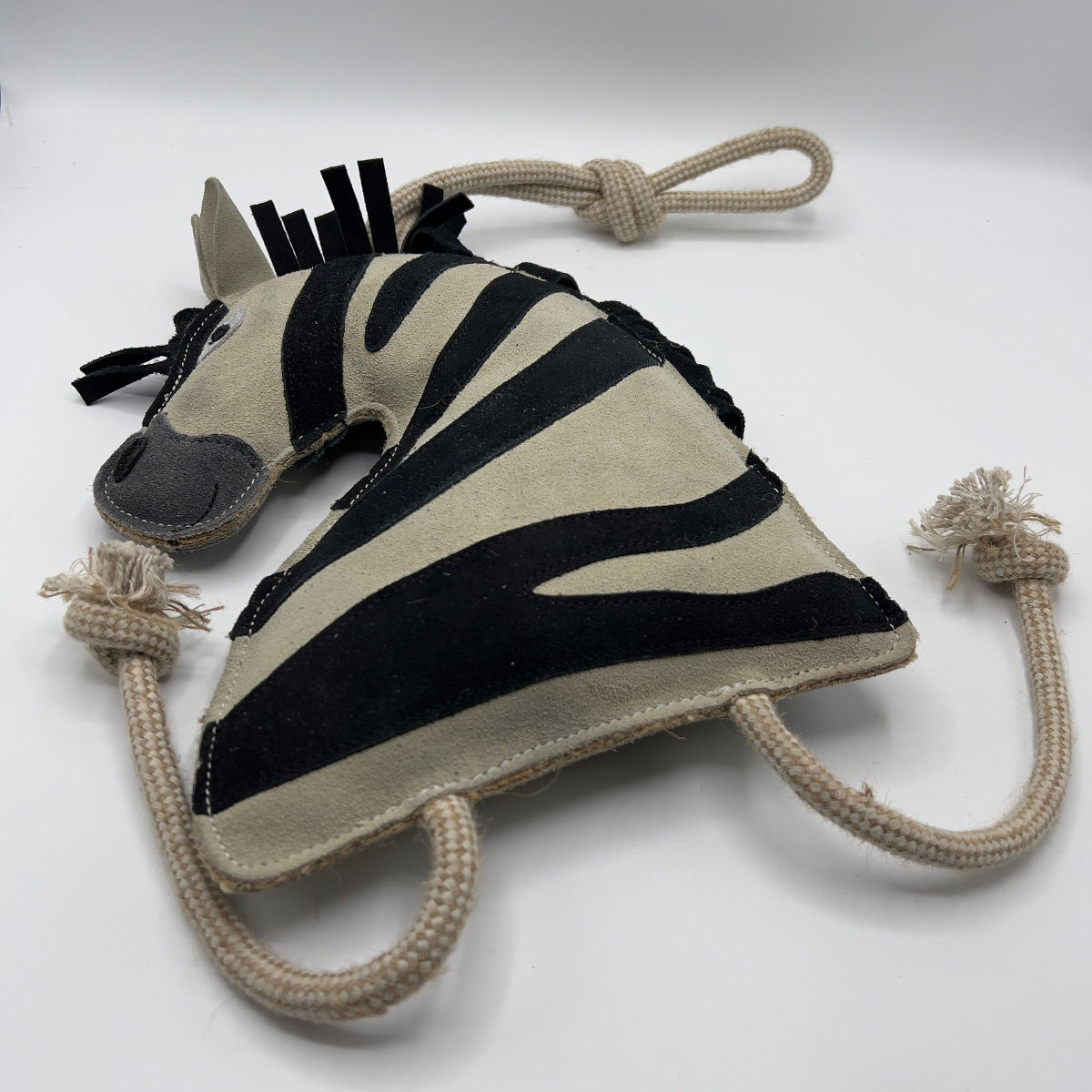 Zebra-shaped horse and dog toy with rope handle from green and wilds
