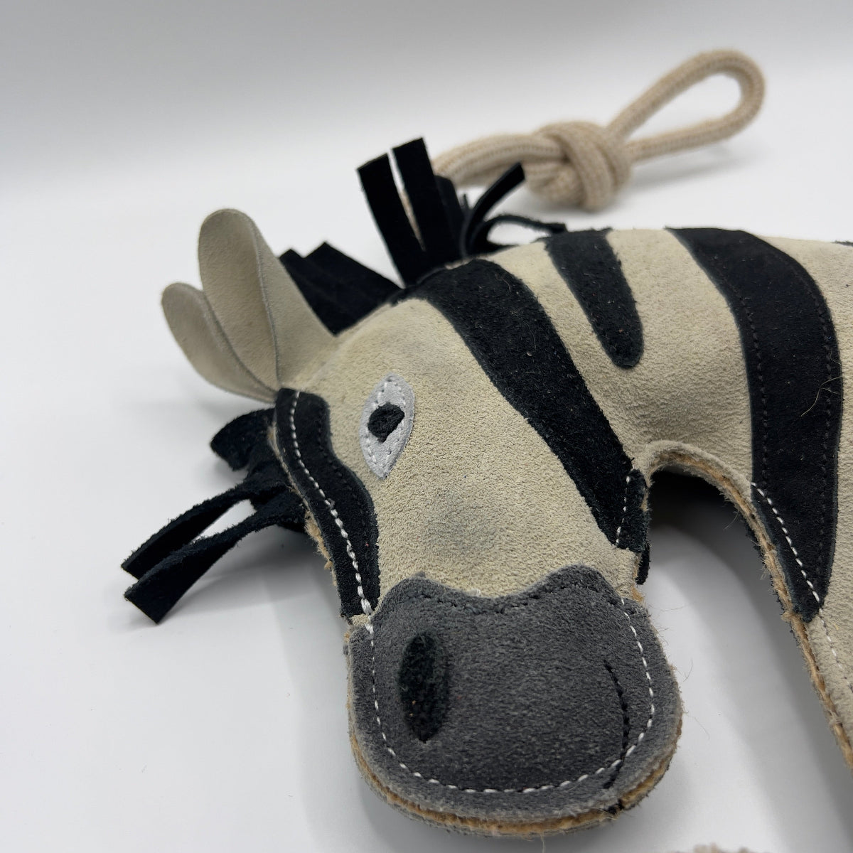 Zebra-shaped horse and dog toy with rope handle from green and wilds