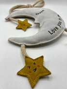 moon and star dog toy with text 'love you to the moon and back'