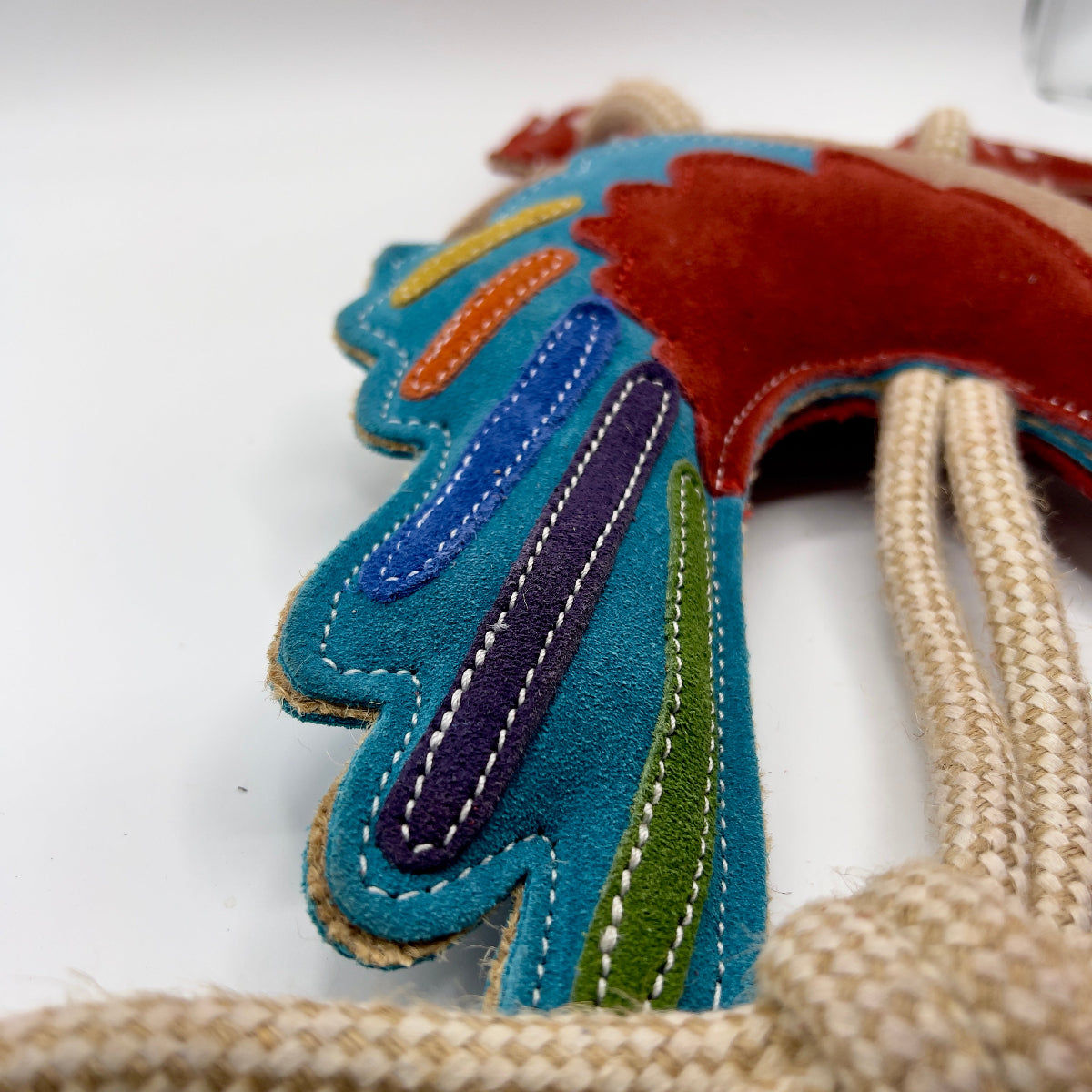 Rooster-shaped horse and dog toy with rope handle from green and wilds