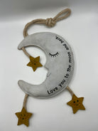moon and star dog toy with text 'love you to the moon and back'