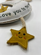 moon and star dog toy with text 'love you to the moon and back'