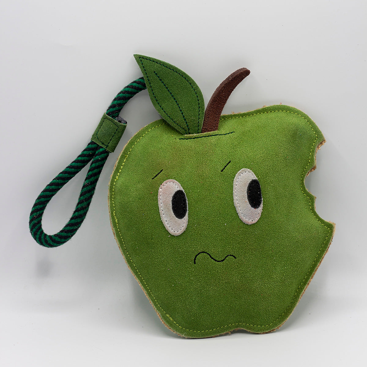 Horse and dog toy shaped as a nervous bitten green apple - green and wilds