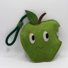 Horse and dog toy shaped as a nervous bitten green apple - green and wilds