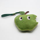 Horse and dog toy shaped as a nervous bitten green apple - green and wilds