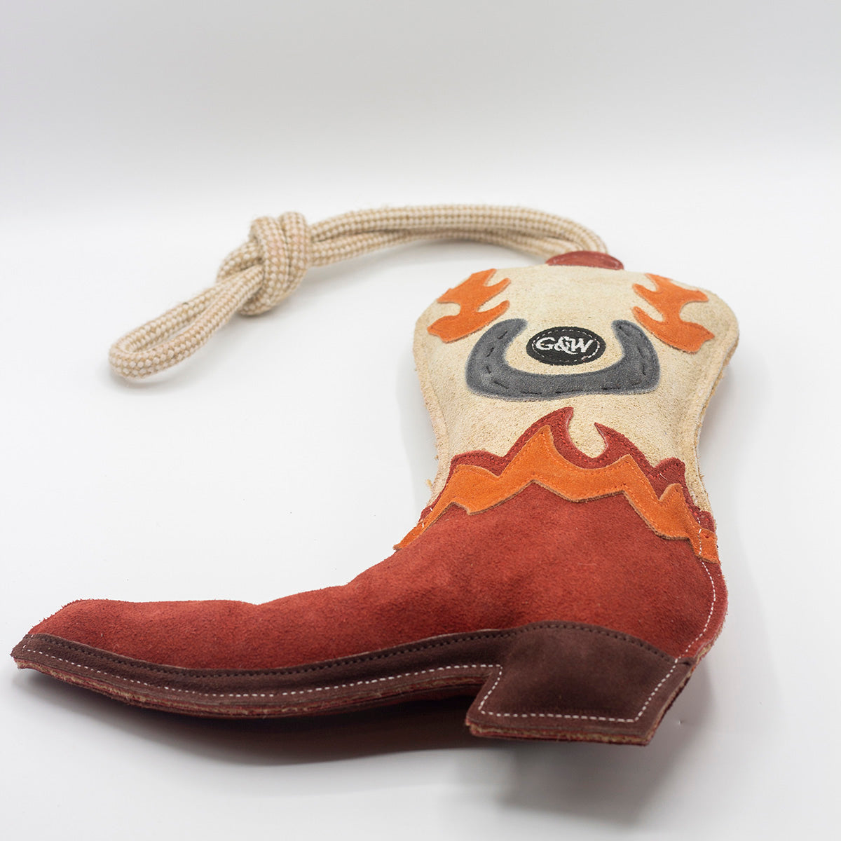 Cowboy boot-shaped horse and dog toy with rope handle from green and wilds