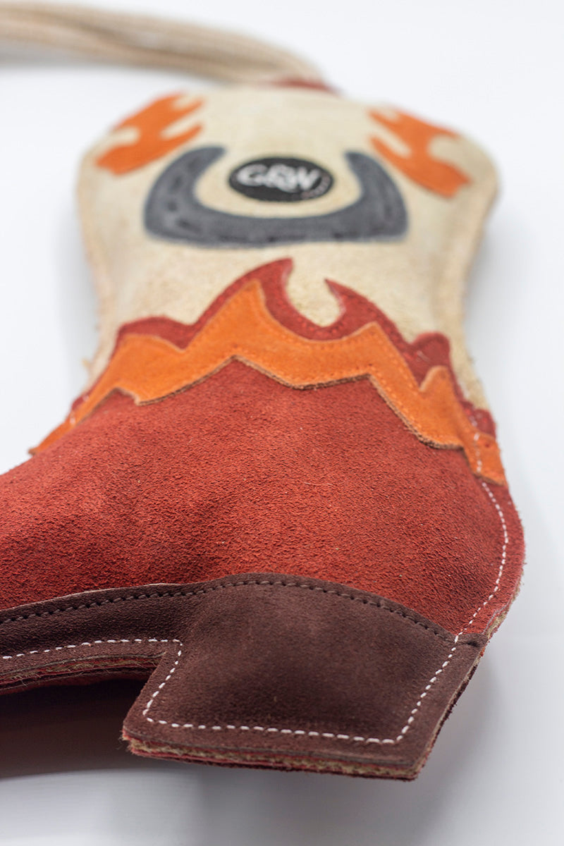 Cowboy boot-shaped horse and dog toy with rope handle from green and wilds