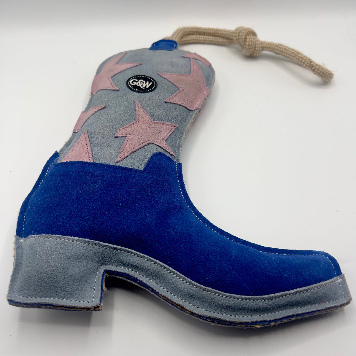 Blue and grey cowboy boot-shaped dog toy with pink stars