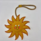 Sun-shaped dog and horse toy with a smiley face from Green and Wilds