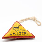 Triangle-shaped horse and dog toy with 'Danger!' warning sign and rope