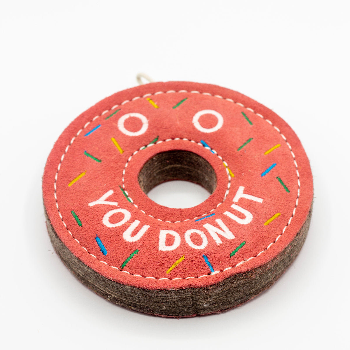 donut-shaped dog toy with 'You Donut' text and colorful sprinkles
