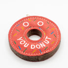 donut-shaped dog toy with 'You Donut' text and colorful sprinkles