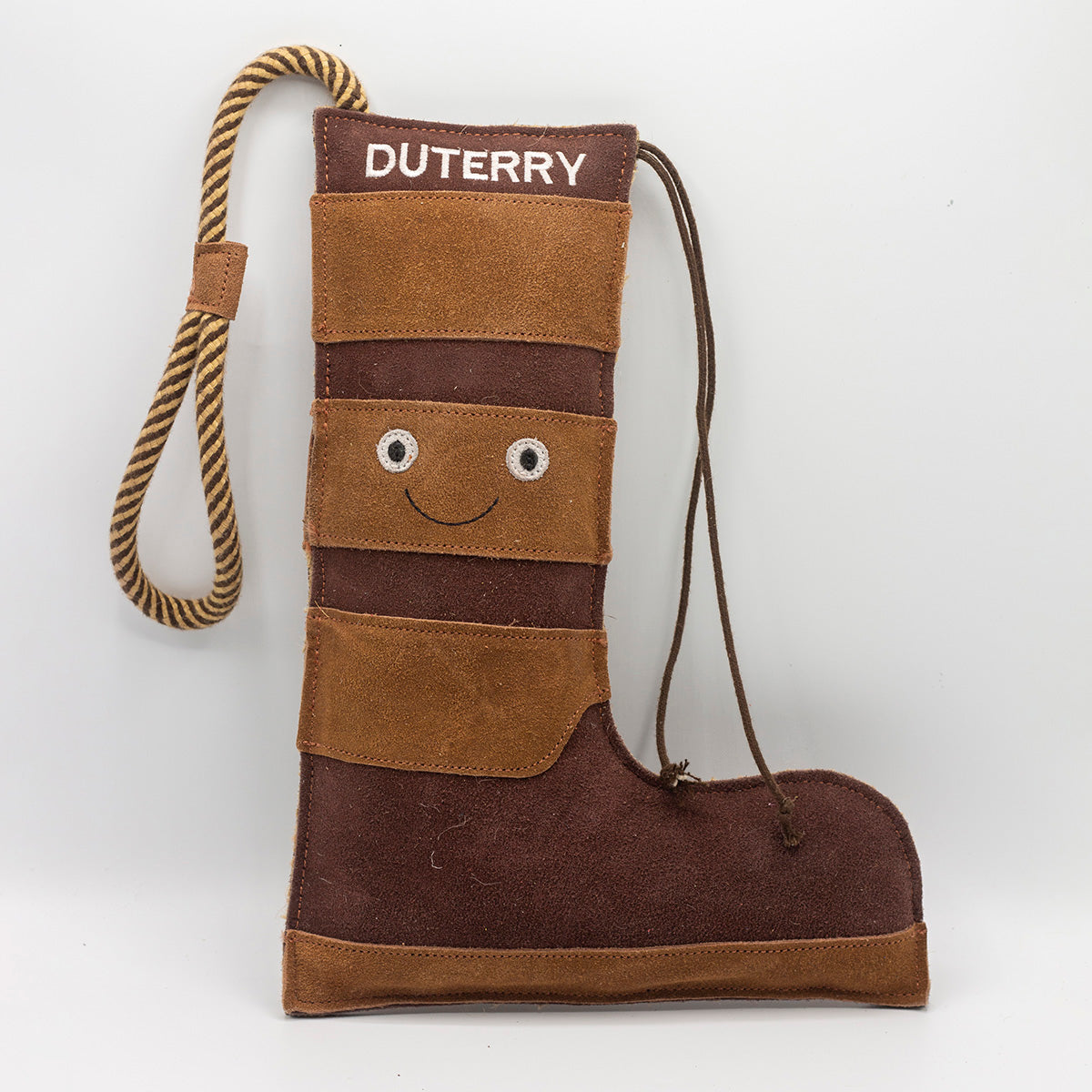 Brown boot-shaped dog toy with 'Duterry' written on it from green and wilds
