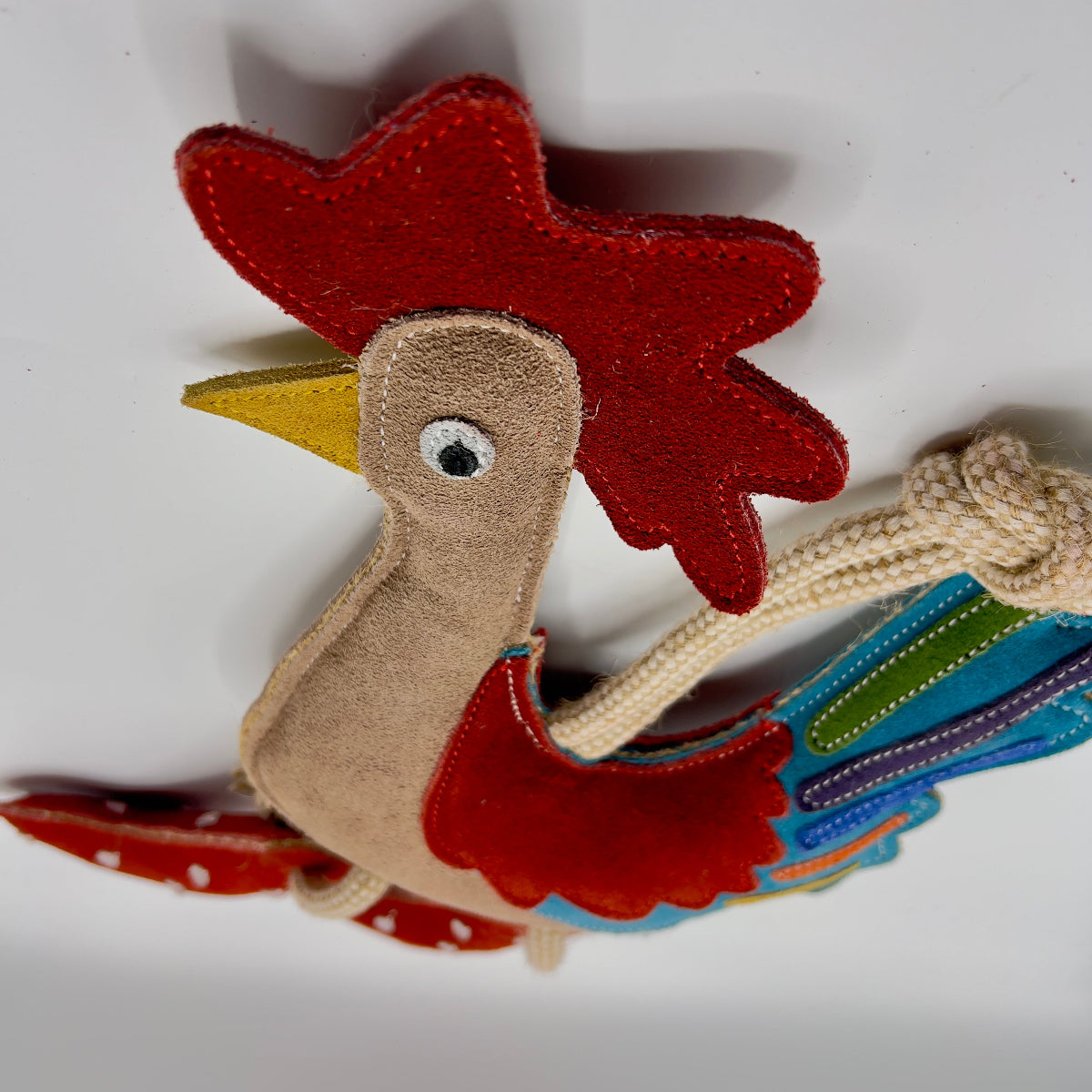 Rooster-shaped horse and dog toy with rope handle from green and wilds