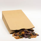 Dog treats shaped as stars in a paper bag