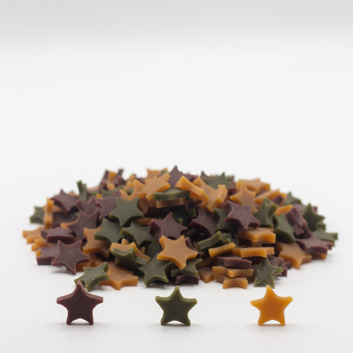 Dog treats shaped as stars in a paper bag