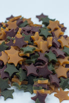 Dog treats shaped as stars in a paper bag