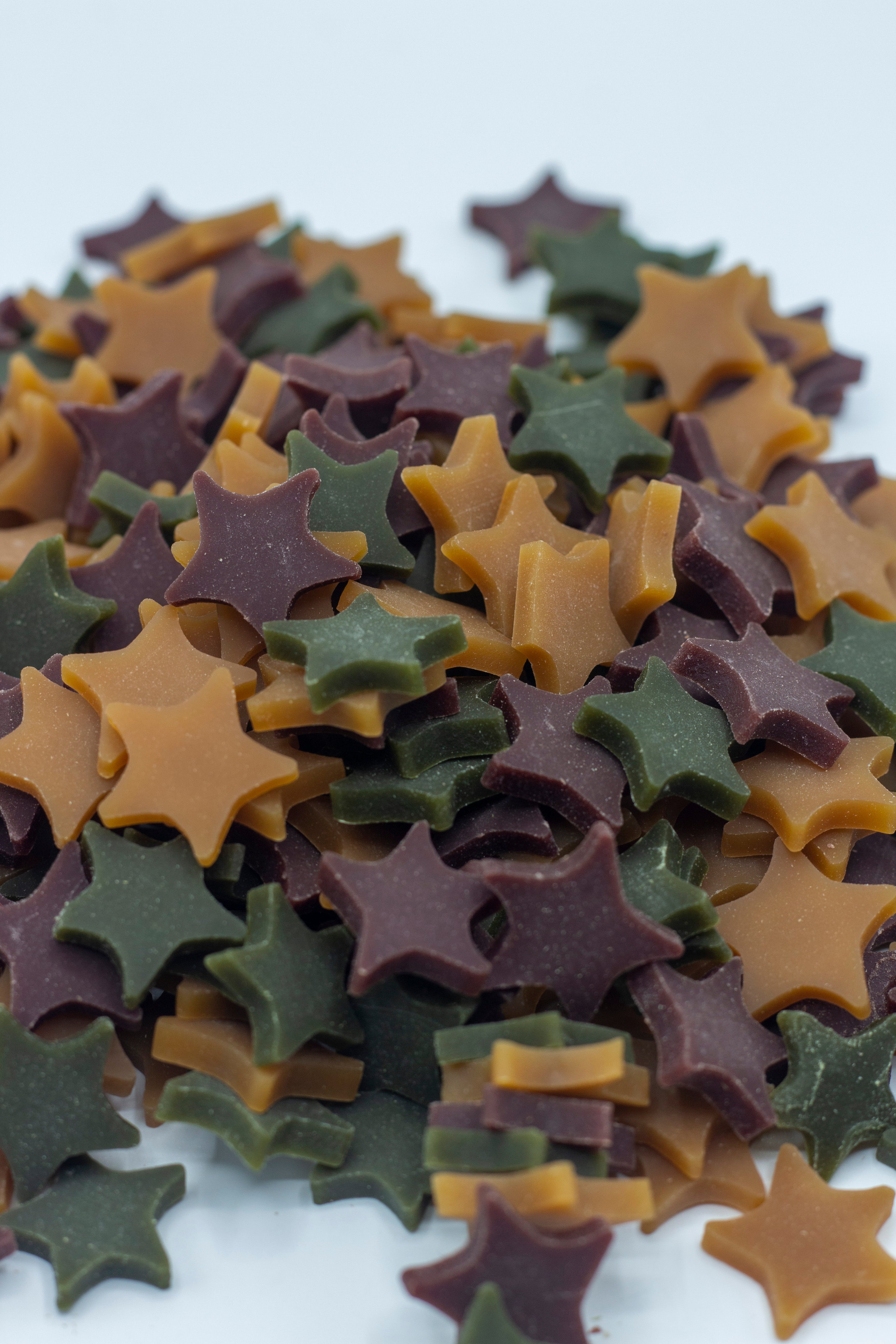 Dog treats shaped as stars in a paper bag