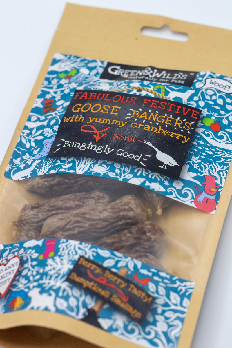 Package of Green & Wilds Christmas dog treats with a decorative label