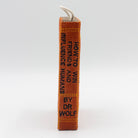 book-shaped dog toy with 'How to Win Friends and Influence Humans' text