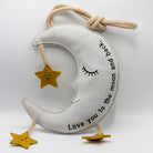 moon and star dog toy with text 'love you to the moon and back'