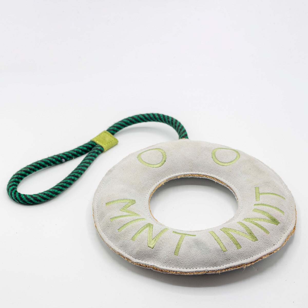 Round green and white dog toy with 'Mint Innit' text - green and wilds