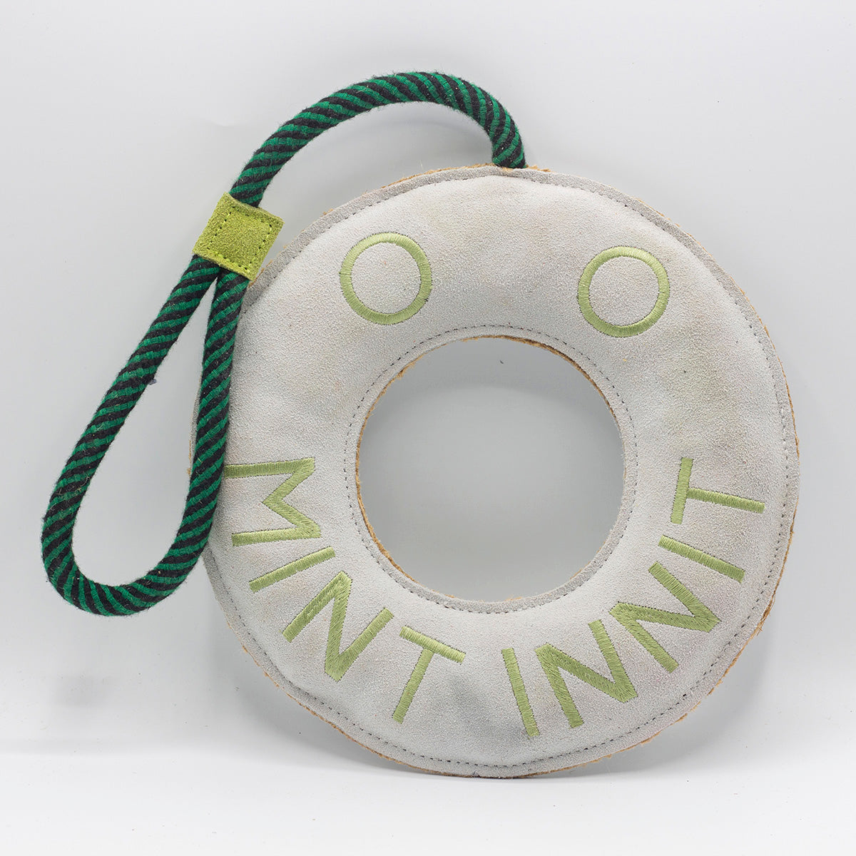 Round green and white dog toy with 'Mint Innit' text - green and wilds