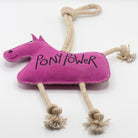 Pink horse-shaped horse and dog toy with 'PONY POWER' text and a rope from green and wilds