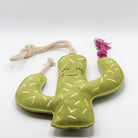 Green cactus-shaped dog toy with a smiling face - green and wilds
