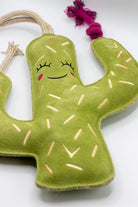 Green cactus-shaped dog toy with a smiling face - green and wilds