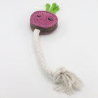 dog toy shaped like a purple radish with a rope on a white background