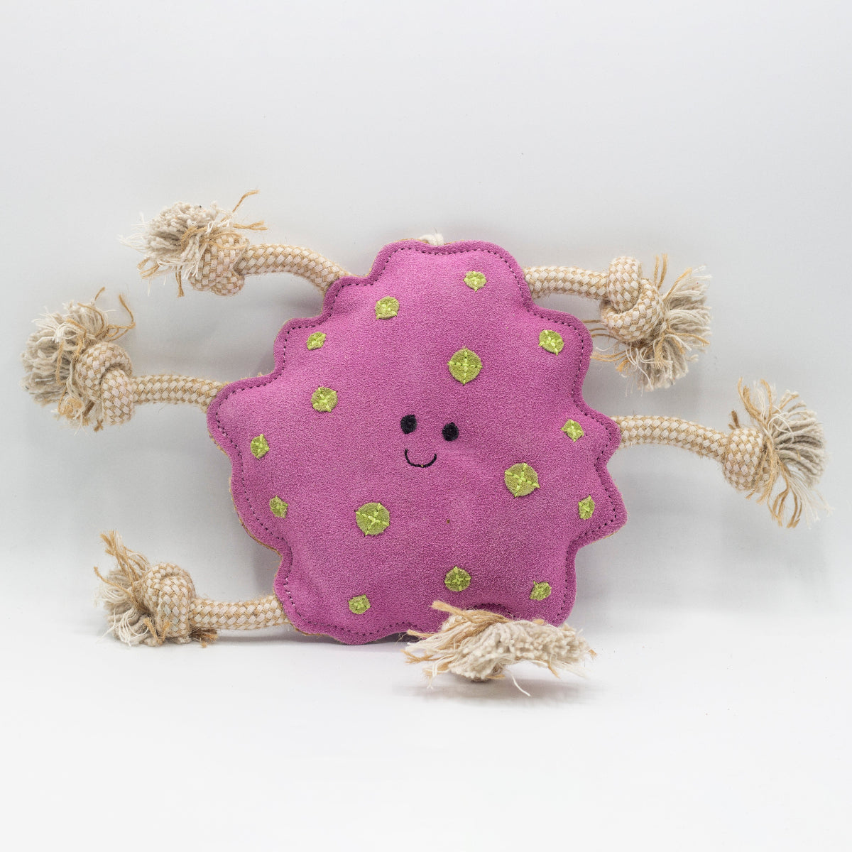 Pink suede dog toy with green spots and beige rope handles