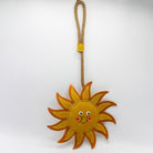 Sun-shaped dog and horse toy with a smiley face from Green and Wilds