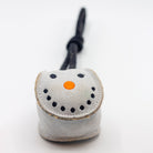 Small grey snowball-shaped Christmas dog toy with a black rope