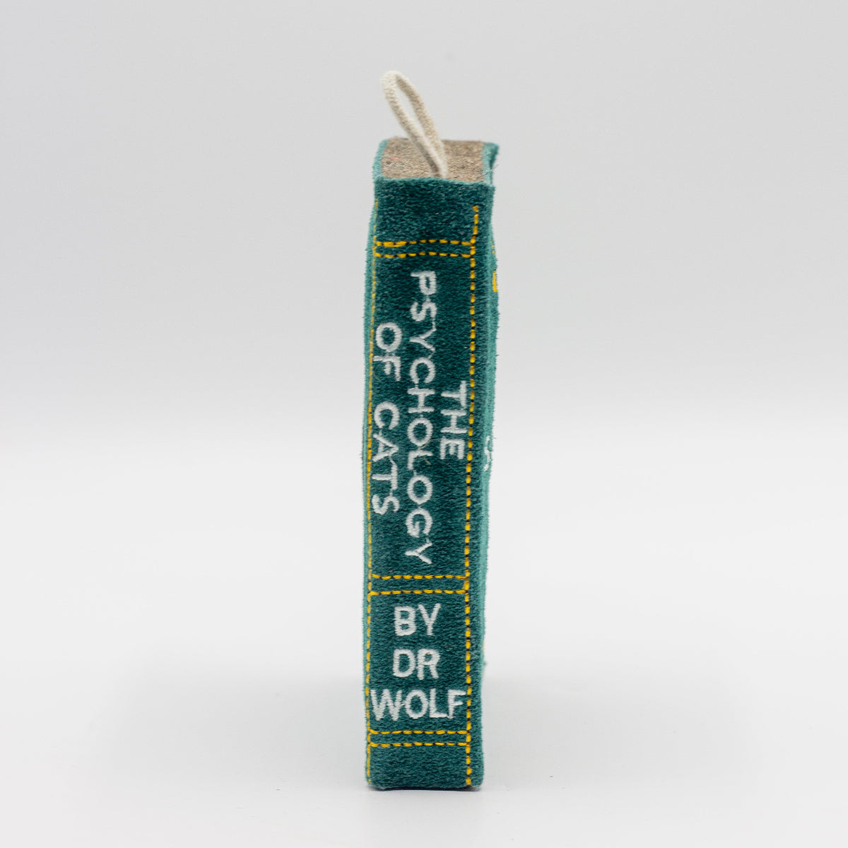 Book-shaped dog toy titled 'The Psychology of Cats'